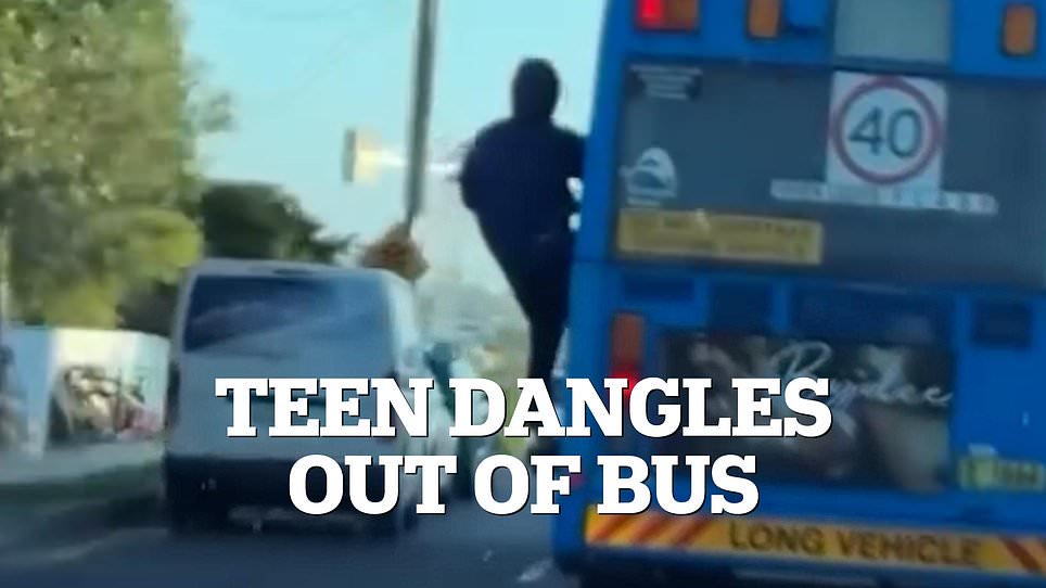 Daredevil teen risks his life by dangling out of a bus