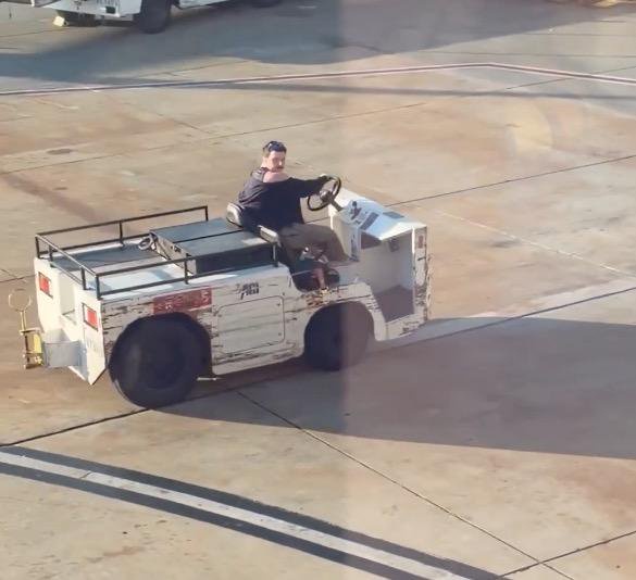 Wild moment unhinged man steals airport tow vehicle for joyride around tarmac at California airport — as maniac is unmasked