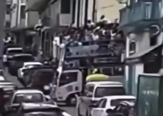 Horrifying moment packed party bus overturns during graduation celebration as students thrown onto pavement after crash