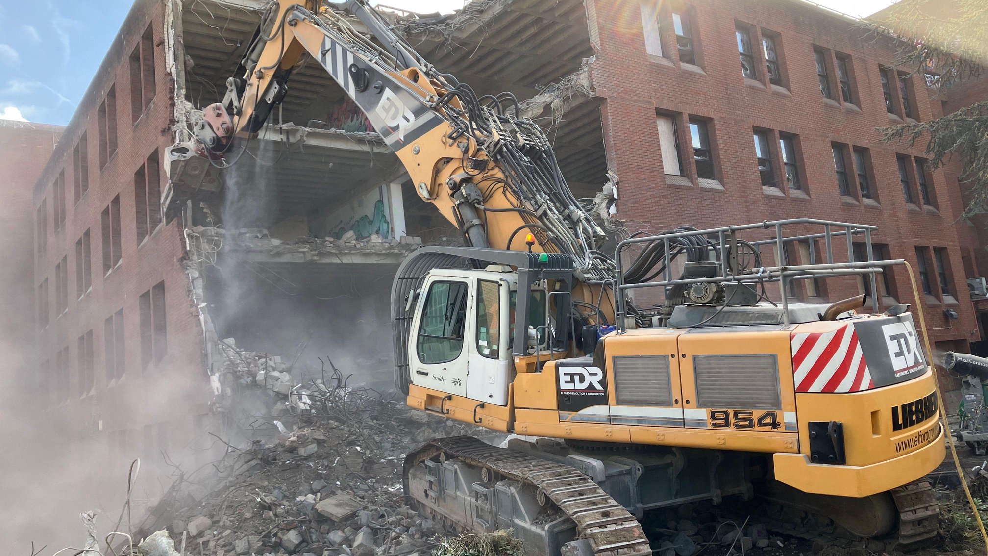 Work starts to demolish vandal-hit office block