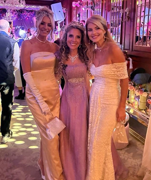 Tess Daly channels her inner Lady Whistledown in a cream satin gown as she parties with Boy George while celebrating her pal’s birthday with a Bridgerton-themed bash