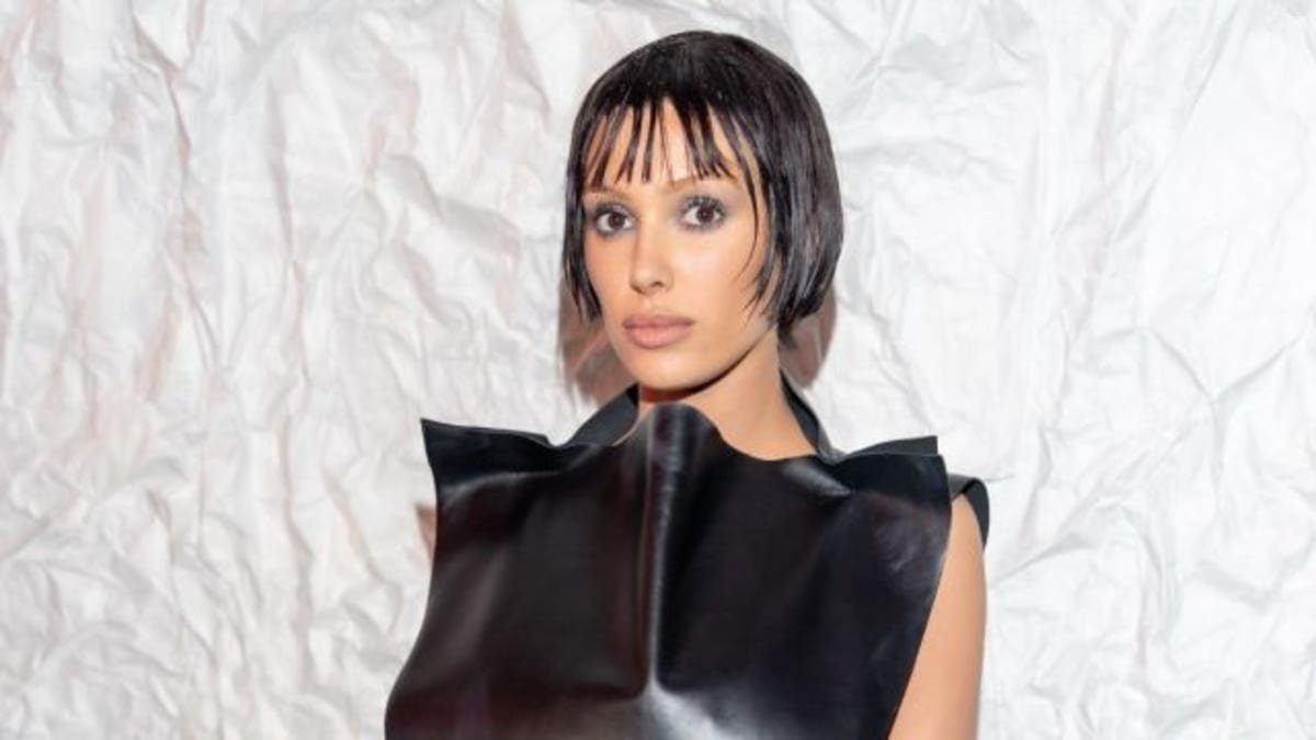 Bianca Censori Uses Hand To Cover up in Fully Sheer Mowalola Fishnet Bodysuit