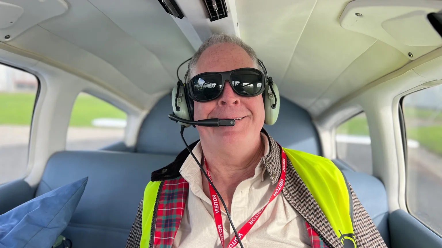 Visually impaired man at ease flying a plane