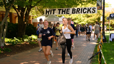 Wake Forest’s student-run Hit the Bricks drew 2,406 runners and walkers for 11,862 laps and raised nearly $407,000 in one day, beating last year’s record and pushing the event past $2.1 million