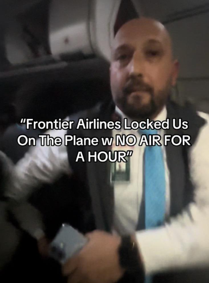 Frontier flight attendant pushes screaming passenger who appears to try to open exit door after flight is stranded at gate