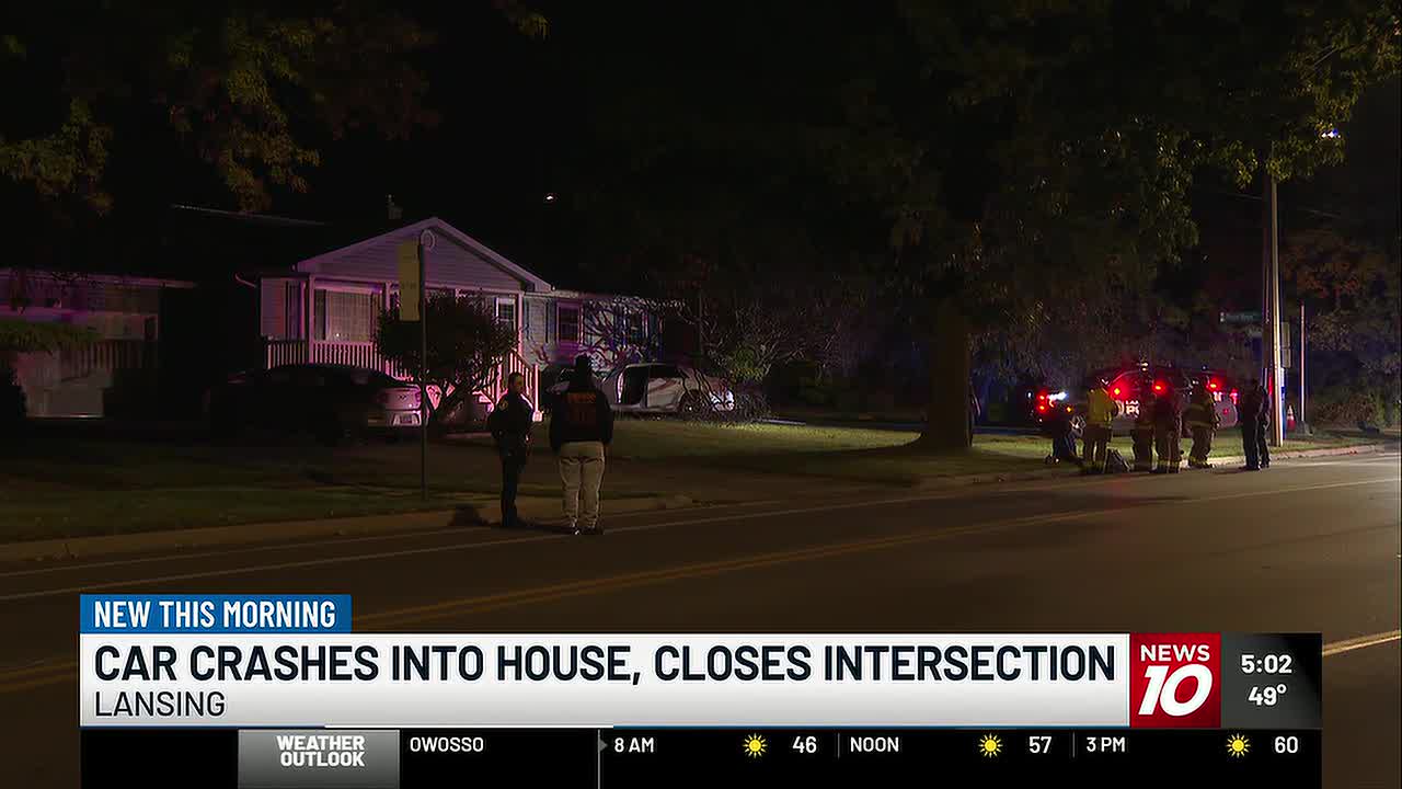 Car crashes into Lansing home early Monday morning