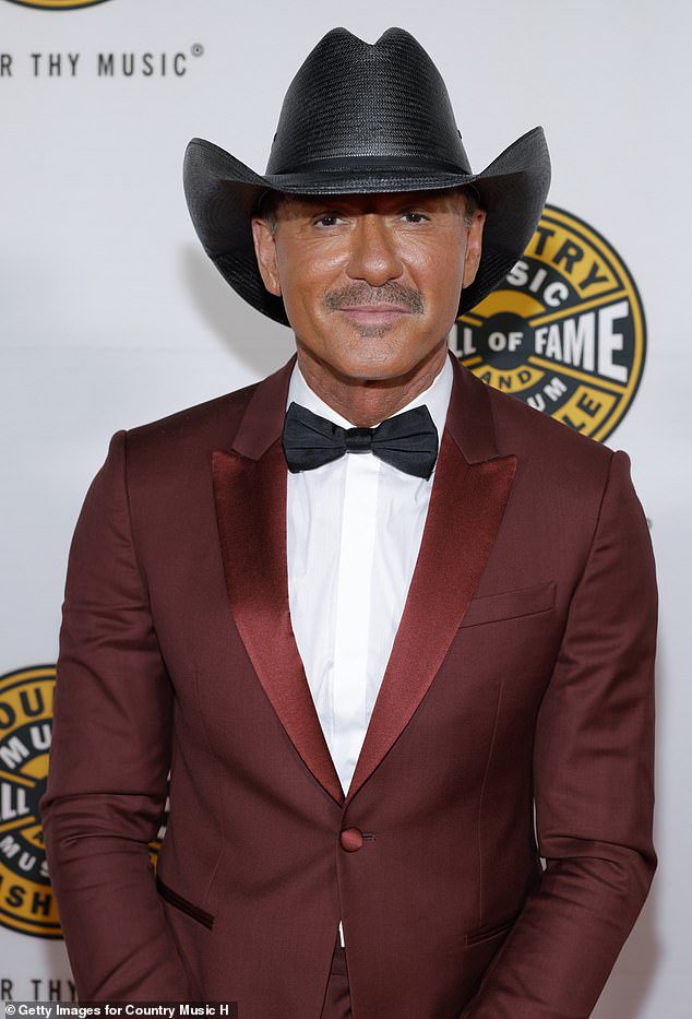 Tim McGraw, 59, steals the spotlight from wife Faith Hill and daughters with luminous tan at glitzy ceremony