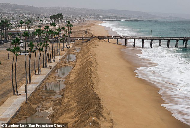 Tropical storm Rachel forces iconic California beach to close as severe flooding threatens millions