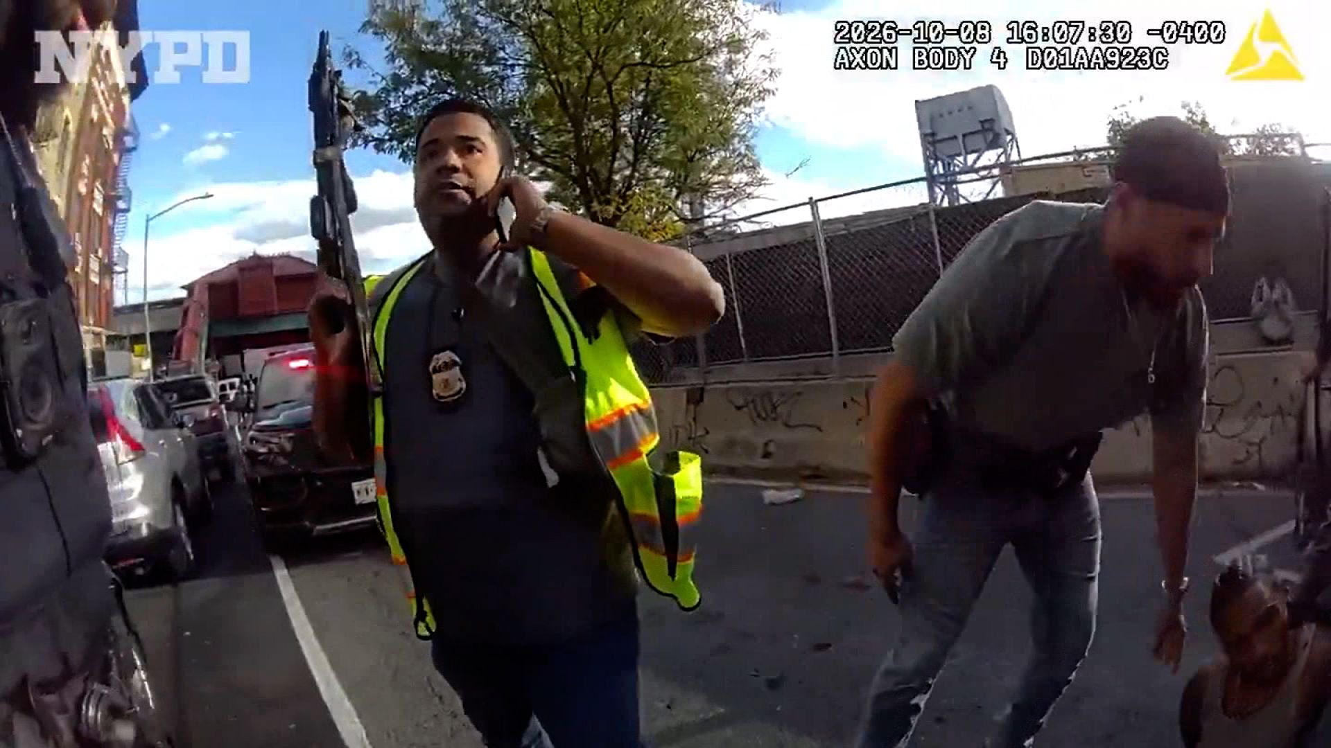 NYPD bodycam shows ICE-involved shooting scene as police transport victim in back of patrol car to hospital