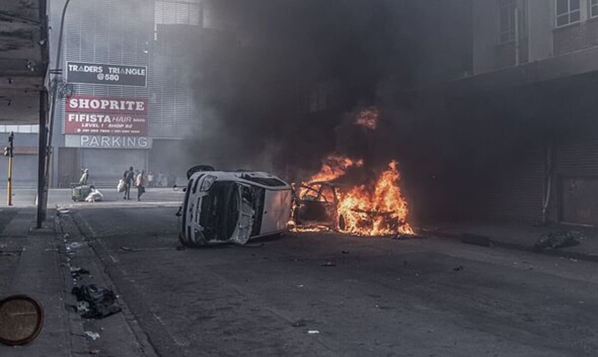 Looting and cars set on fire as migrant protests erupt