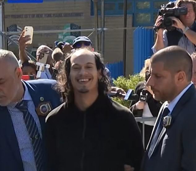 Face of evil: Laughing boyfriend smirks as he’s arrested for pushing girlfriend and baby off 15th floor balcony
