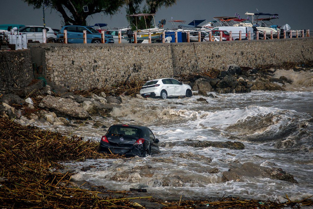 Apocalyptic floods rip through Greek holiday islands killing one as major European city also hammered by torrential rain