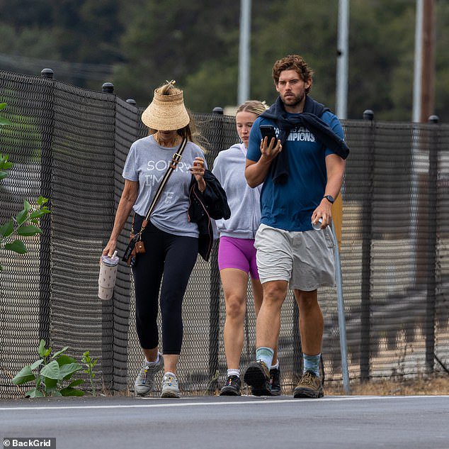 Arnold Schwarzenegger’s son Christopher shows off ripped frame after mammoth weight loss on outing with mom Maria Shriver and girlfriend