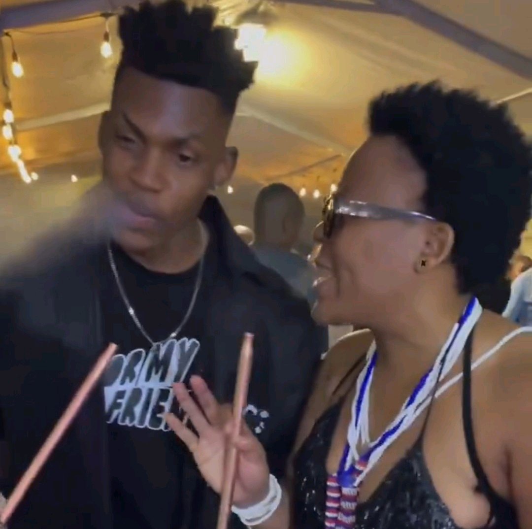 Zodwa Wabantu seen with a younger man sharing a hookah at a crowded event