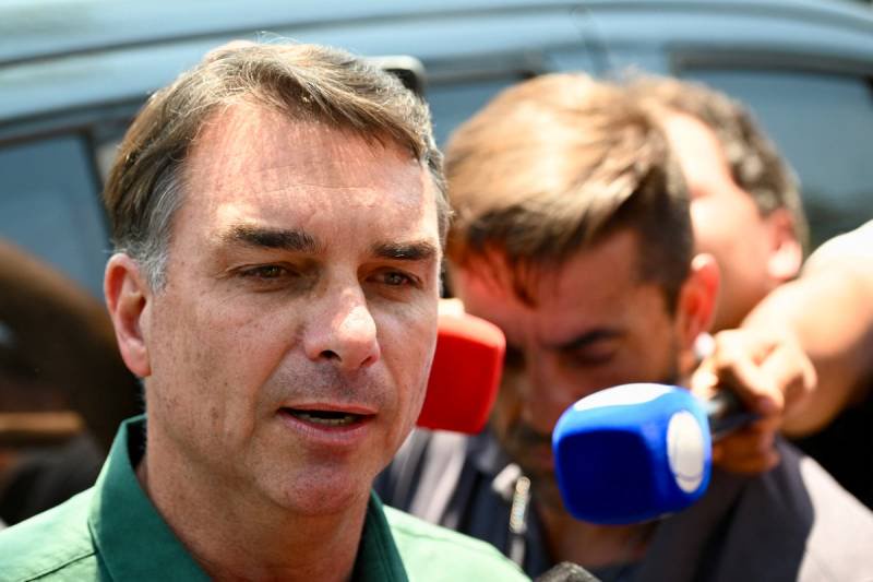 Flavio Bolsonaro visits father under house arrest ahead of Brazil runoff