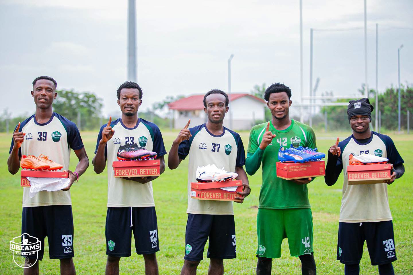 Dreams FC players receive PUMA football boots from GFA