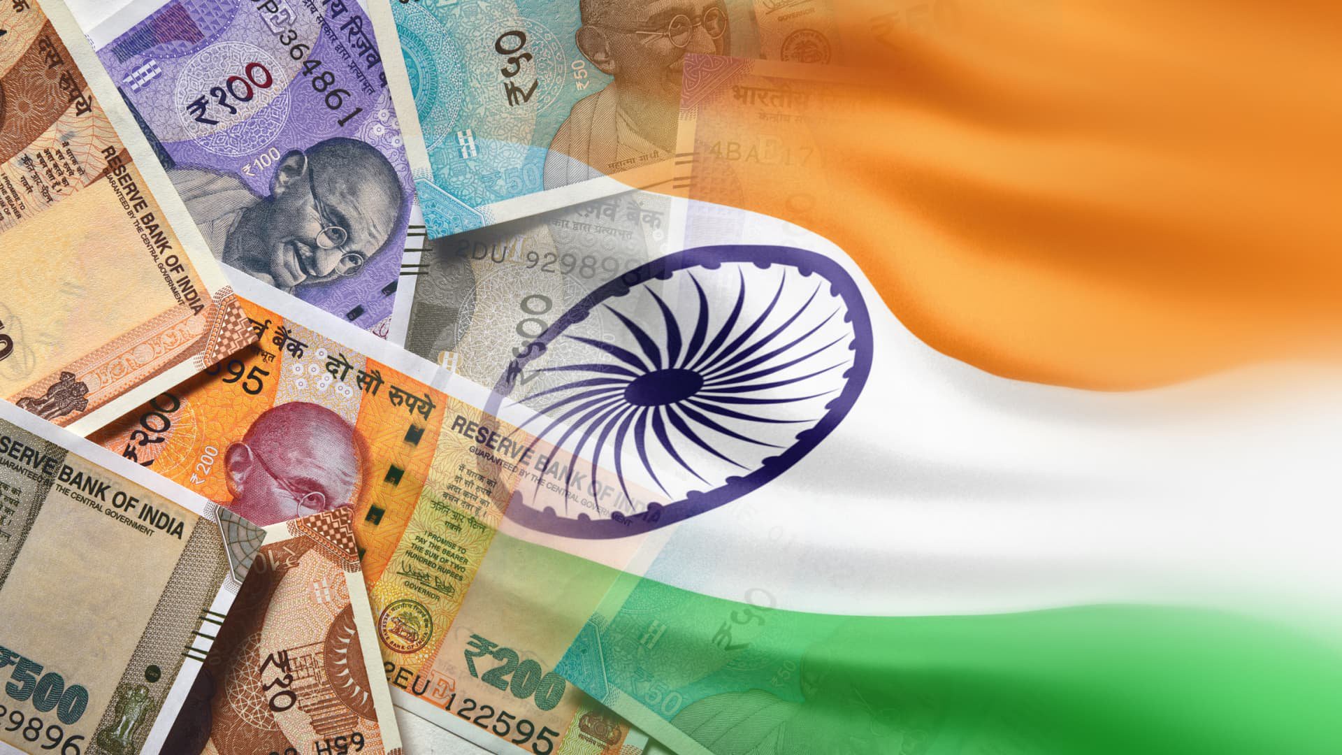 India unveils tough curbs on dollar demand to defend rupee