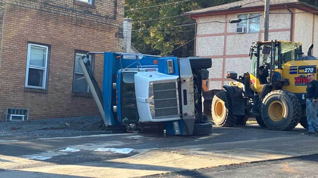 Garbage truck crash closes intersection: Police