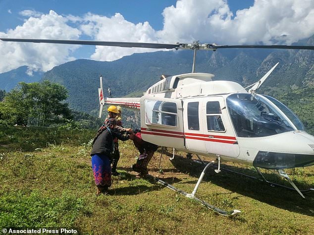 Rescue helicopters race to flood-hit Nepal villages as 5 reported missing