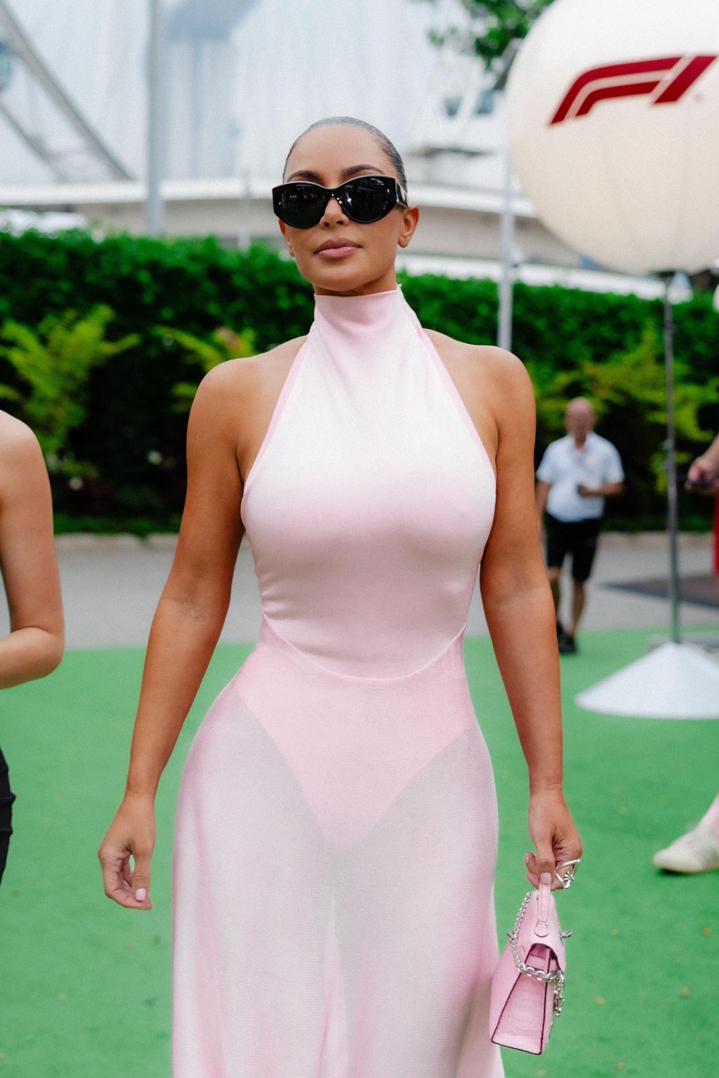 Kim Kardashian wears baby pink leotard, see-through skirt to support Lewis Hamilton at F1 Singapore