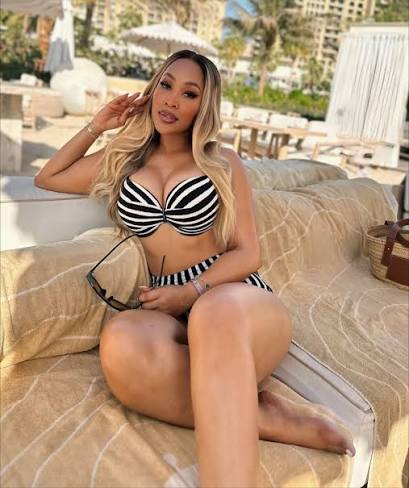 Mpumi Mophatlane Flaunts Her Vacation Body, SA Says Tattoo Placement Is Hiding Cosmetic Surgery Scar
