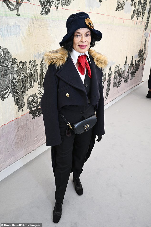 Bianca Jagger gives Northern Irish comedian Jimmy Cricket a run for his money in the style stakes as she attends the Frieze Art Fair in quirky suit ensemble and red tie