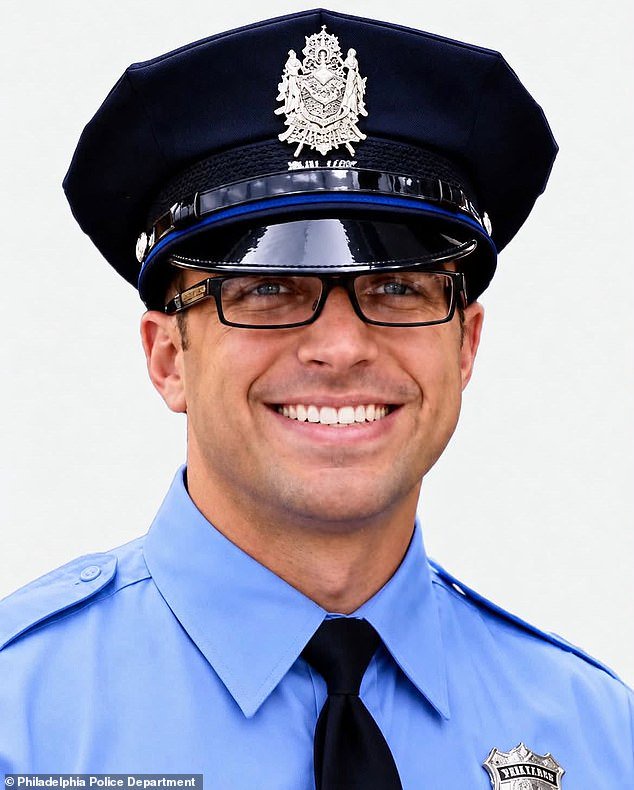 Two police officers riddled with bullets in Philadelphia ambush that left a father of two, 40, dead