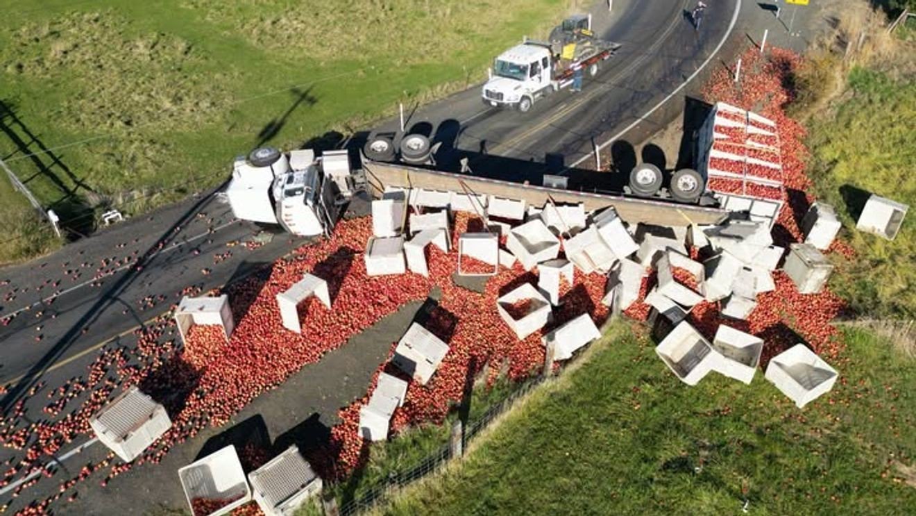 Apple truck slides off road in Benton County; corn truck crash near Pasco injures 1