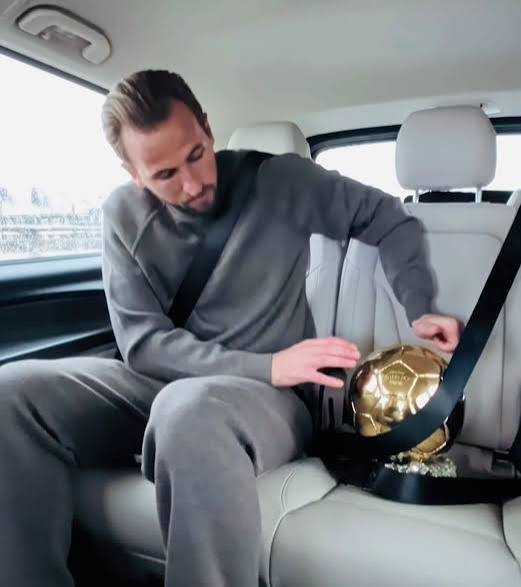 VIDEO: Harry Kane Takes Ballon d’Or Home, Secures It With Seat Belt