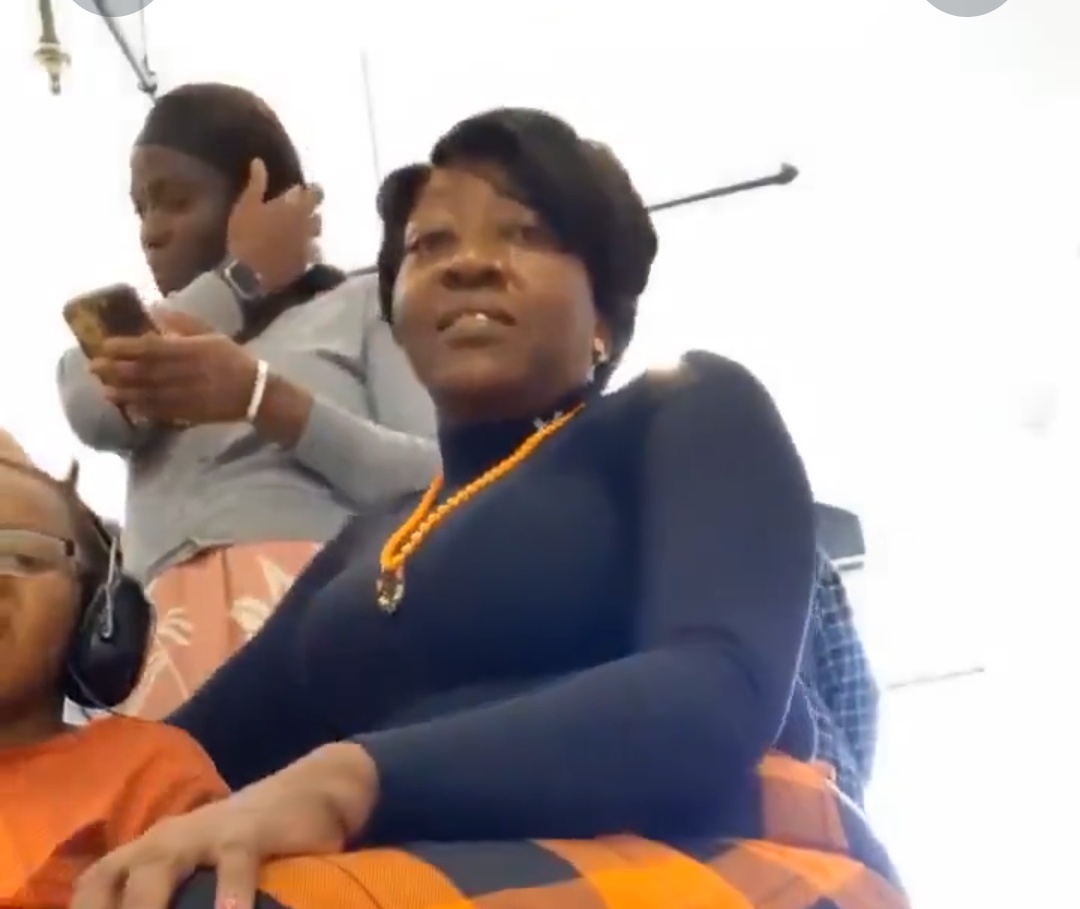 Woman films herself with a phone under her skirt during a church service