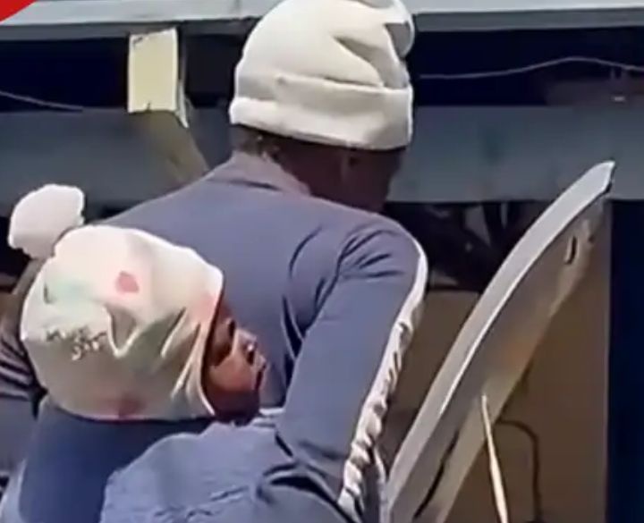 Morning Drama as Woman Storms Hubby’s Workplace While Carrying Their Baby on Her Back, Details Below