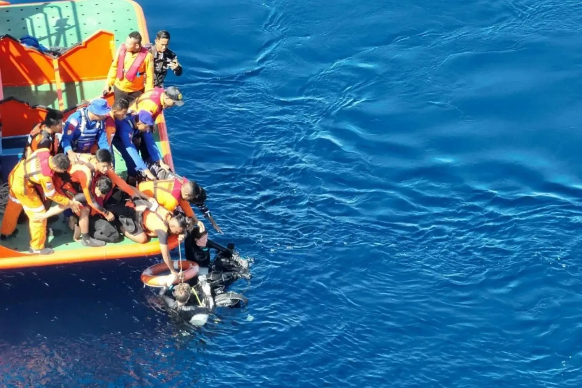 Missing tourists who were swept away on diving trip are miraculously found alive after spending 24 hours lost in sea