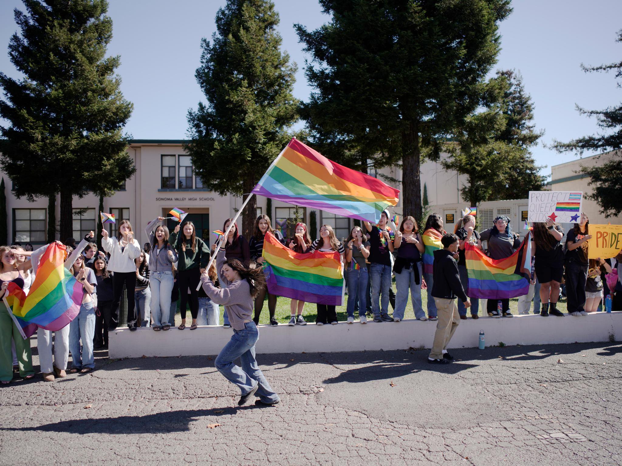 Dozens of students walk out of class after school district removed Pride flags from buildings