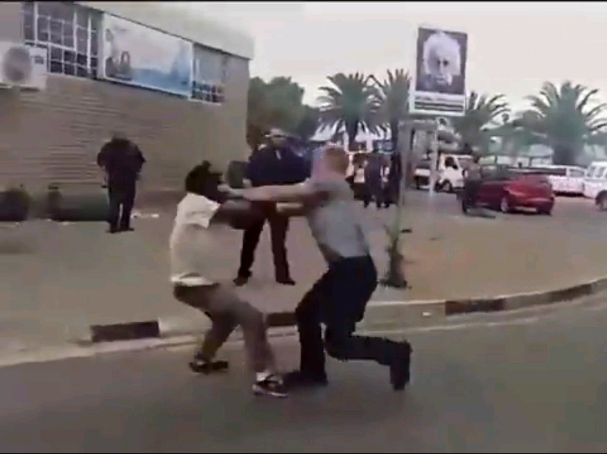 White man overpowers two black men in filmed confrontation