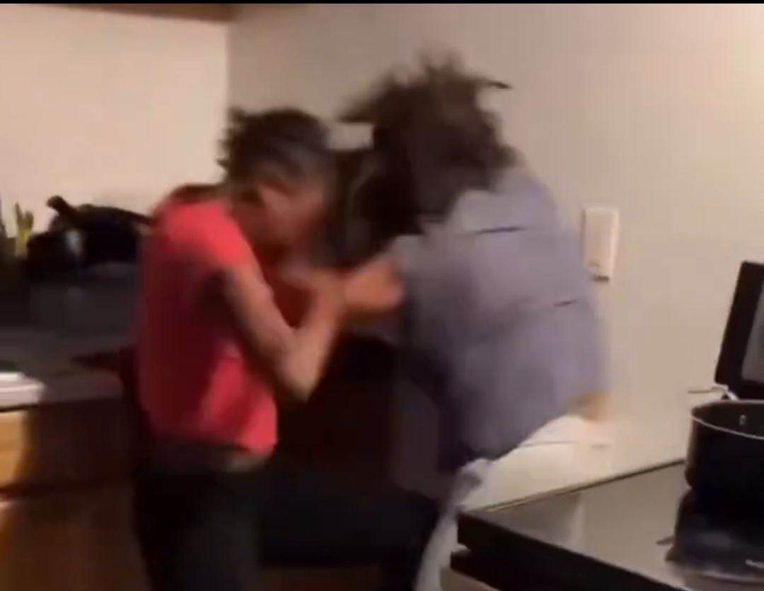 Mother and daughter filmed fighting each other inside a kitchen