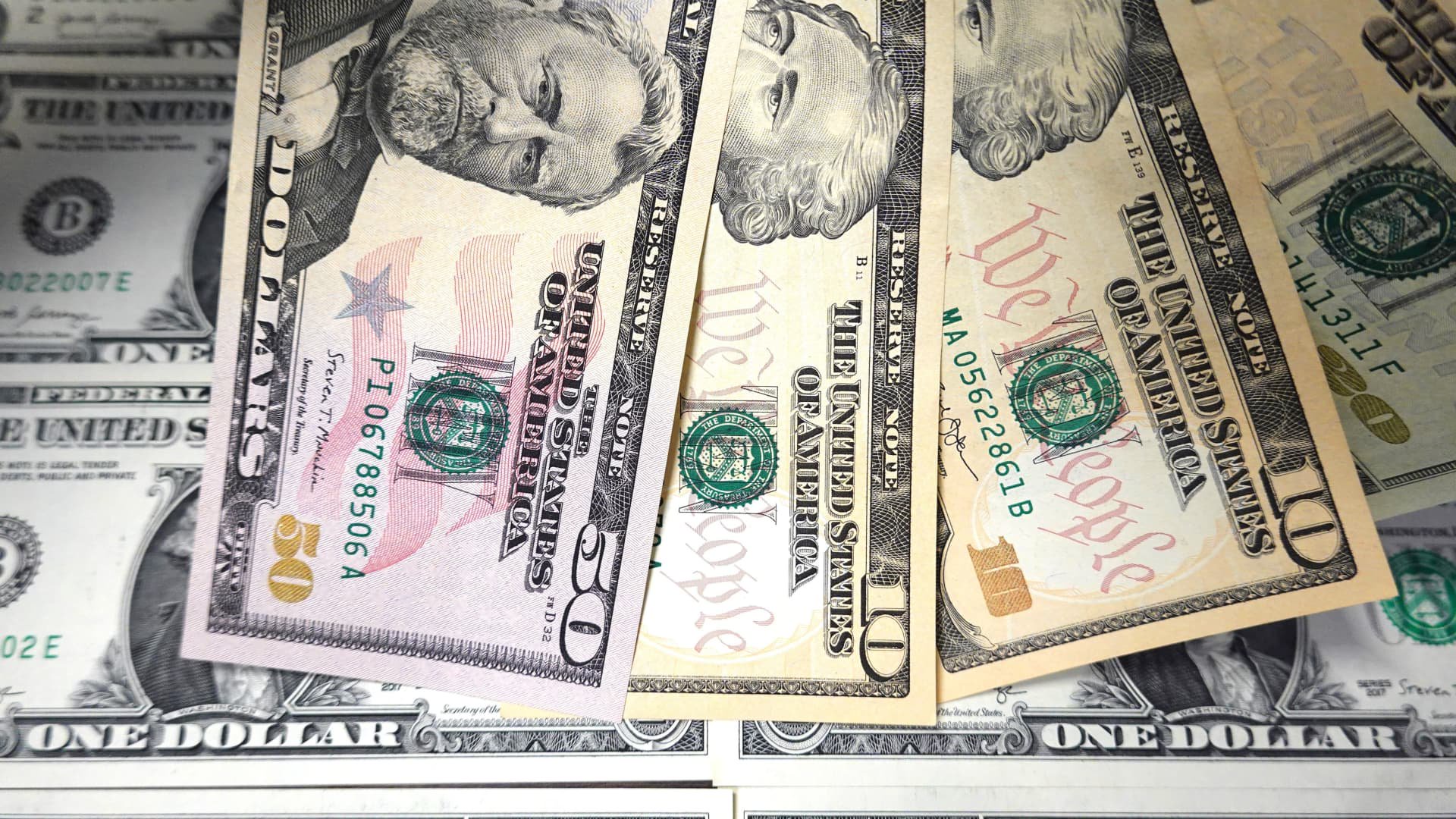 Dollar retreats from 18-month high despite hot CPI as Fed officials temper hike bets