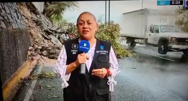 Terrifying moment out-of-control car swerves into TV presenter and cameraman