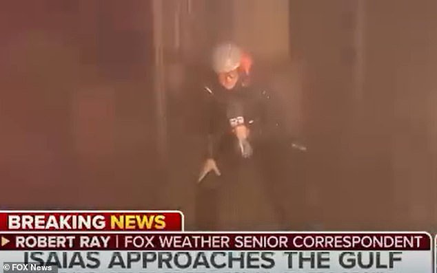 Weatherman panned for ‘dramatically bracing’ in Hurricane Isaias winds as local nonchalantly walks through frame