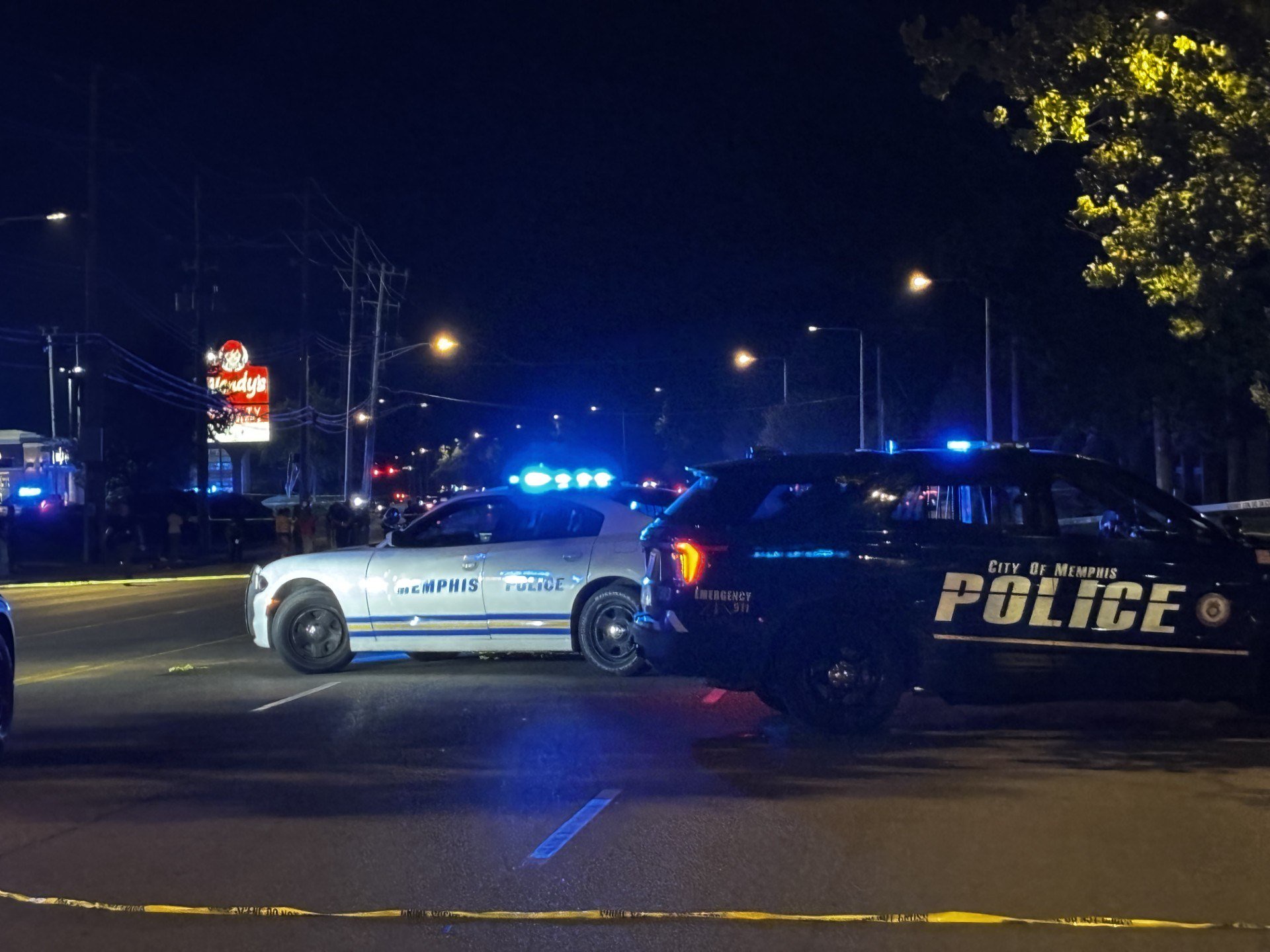 One dead, one wounded, six detained in shooting near fast food restaurant
