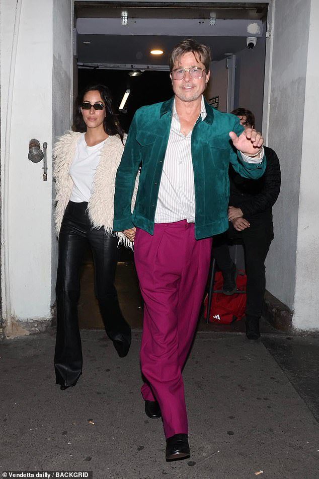 Brad Pitt, 62, turns heads in bold magenta trousers and a teal jacket on a date night with glamorous girlfriend Ines de Ramon, 33, in Paris