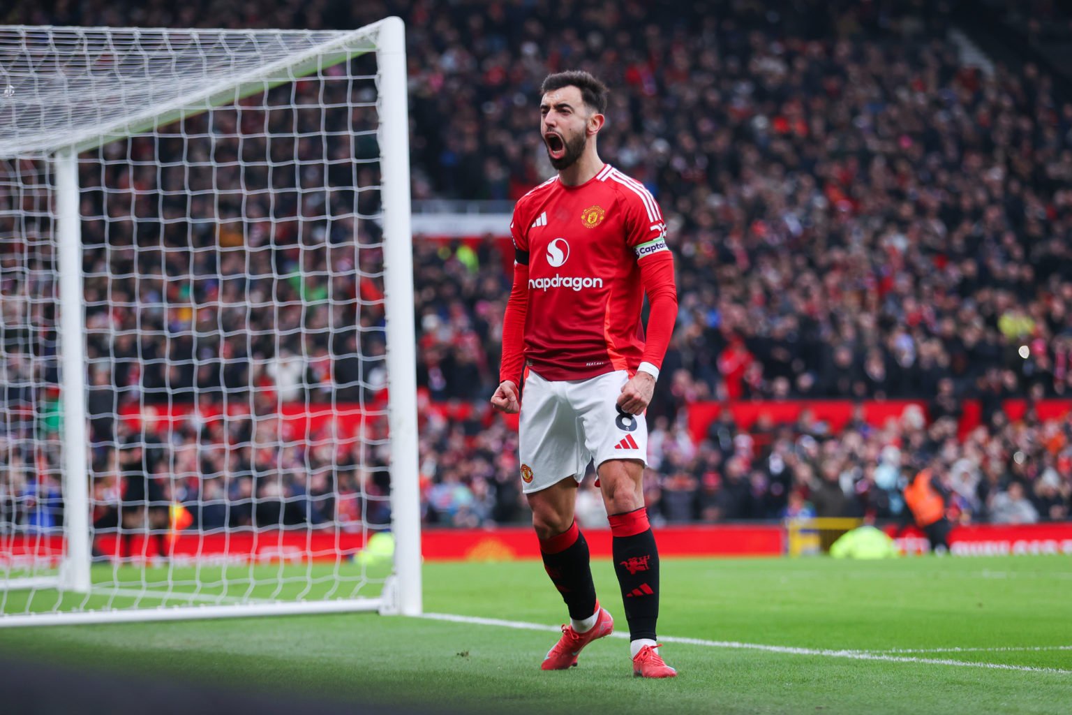 Bruno Fernandes of Manchester United  celebrates after scoring their side's first goal from the penalty spot during the Premier League match betwee...