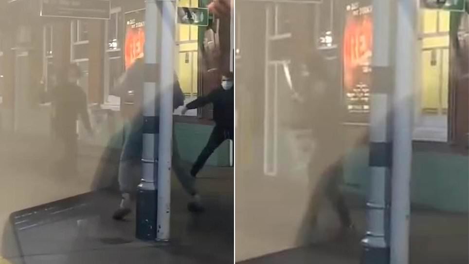 Moment three knife-wielding youths fight on station platform