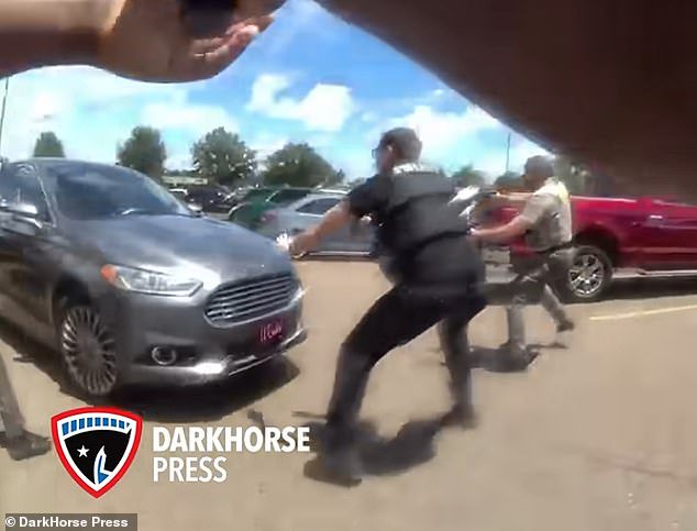 Shocking final moments of baby captured on police bodycam after his mother and aunt ‘shoplifted’ at Walmart then drove car at cops who opened fire