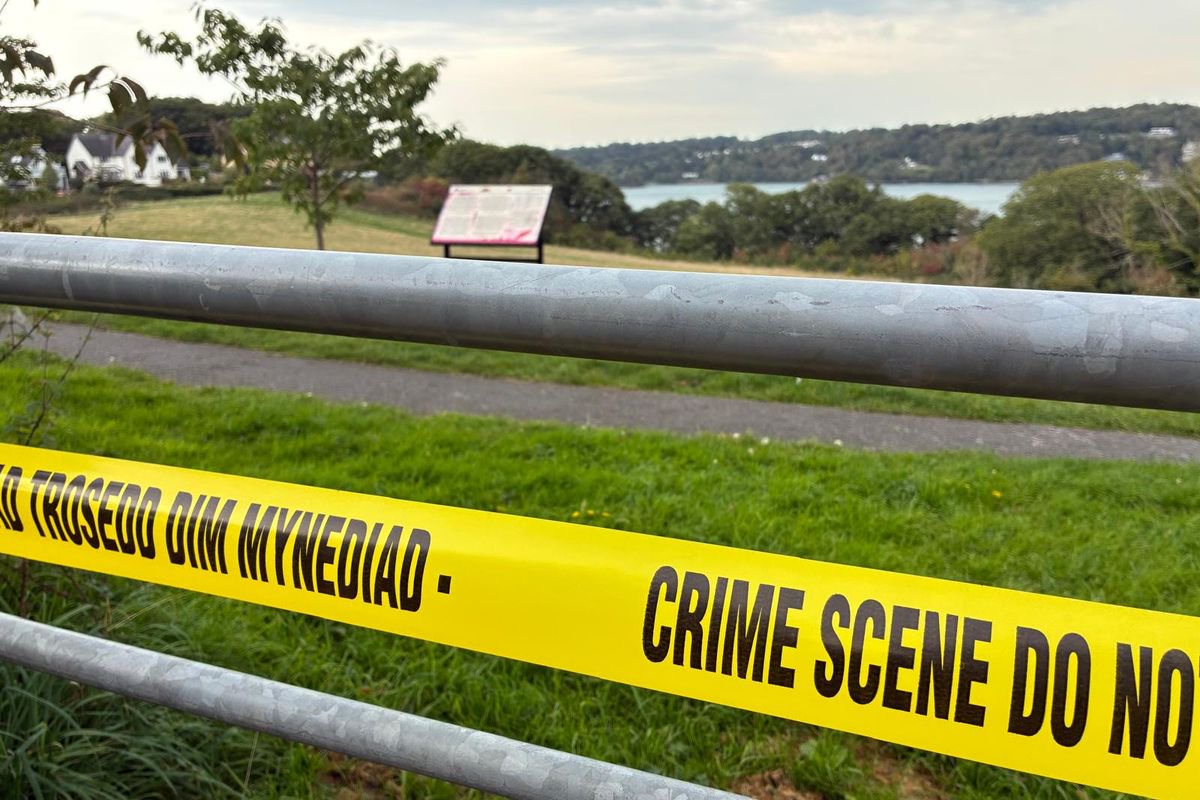 Search for mother continues after body of baby discovered beside Menai Strait