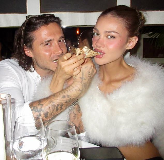 Brooklyn Beckham and his wife Nicola Peltz put on a loved-up display in cozy snaps