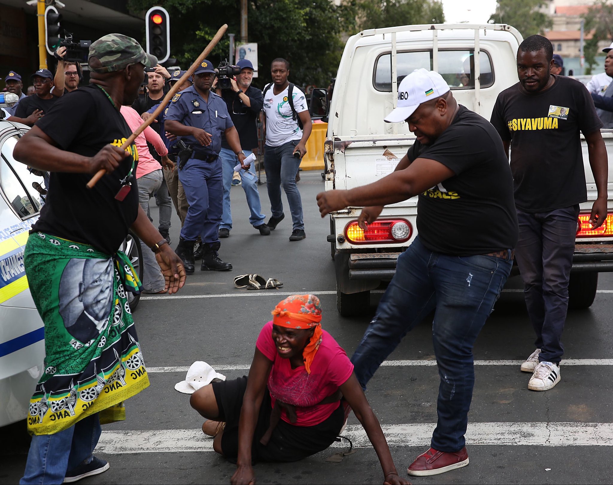 Woman filmed being kicked and struck by men allegedly linked to the ANC
