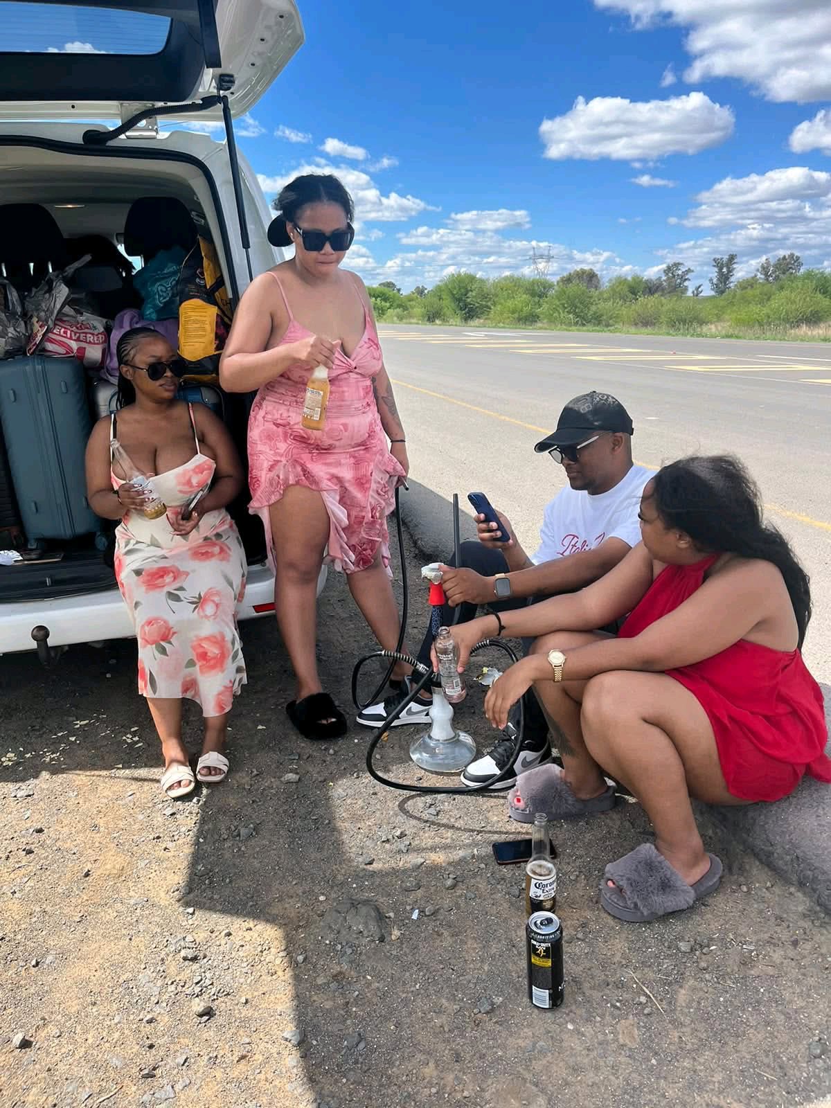 Four Young People Spark Attention After Drinking and Smoking Hookah by Roadside