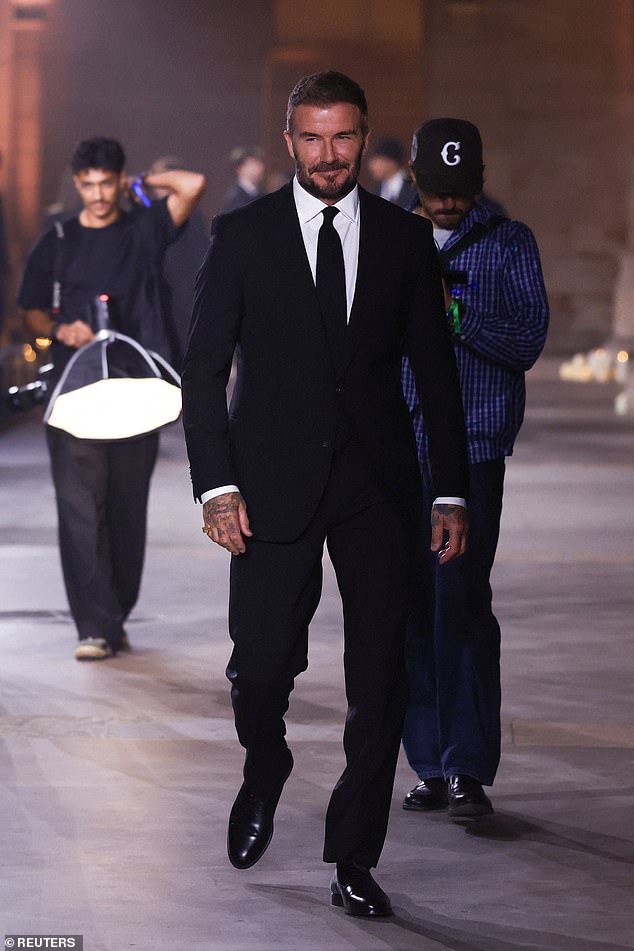David Beckham leads his family in supporting wife Victoria at her Paris Fashion Week show – as estranged son Brooklyn snubs the event following the footballer’s olive branch