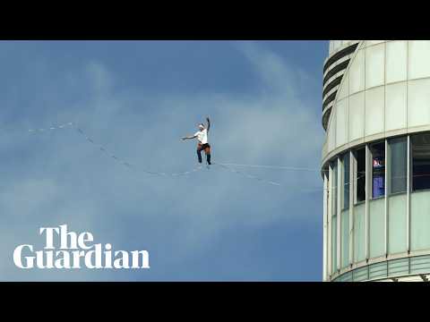 Jaan Roose amazes crowds with 120 metre-high slackline walk above Seoul – video