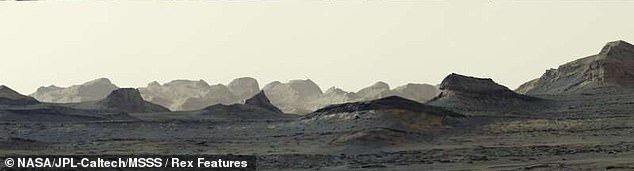 NASA rover captures breathtaking Martian dawn as mysterious cliffs emerge from the darkness